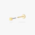 Gold micro CZ flatback stud earring with small yellow stone in prong setting shown from side angle