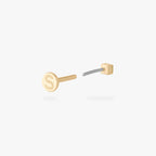 Gold micro CZ flatback stud earring with engraved letter S on the backing shown from back angle with flat backing visible