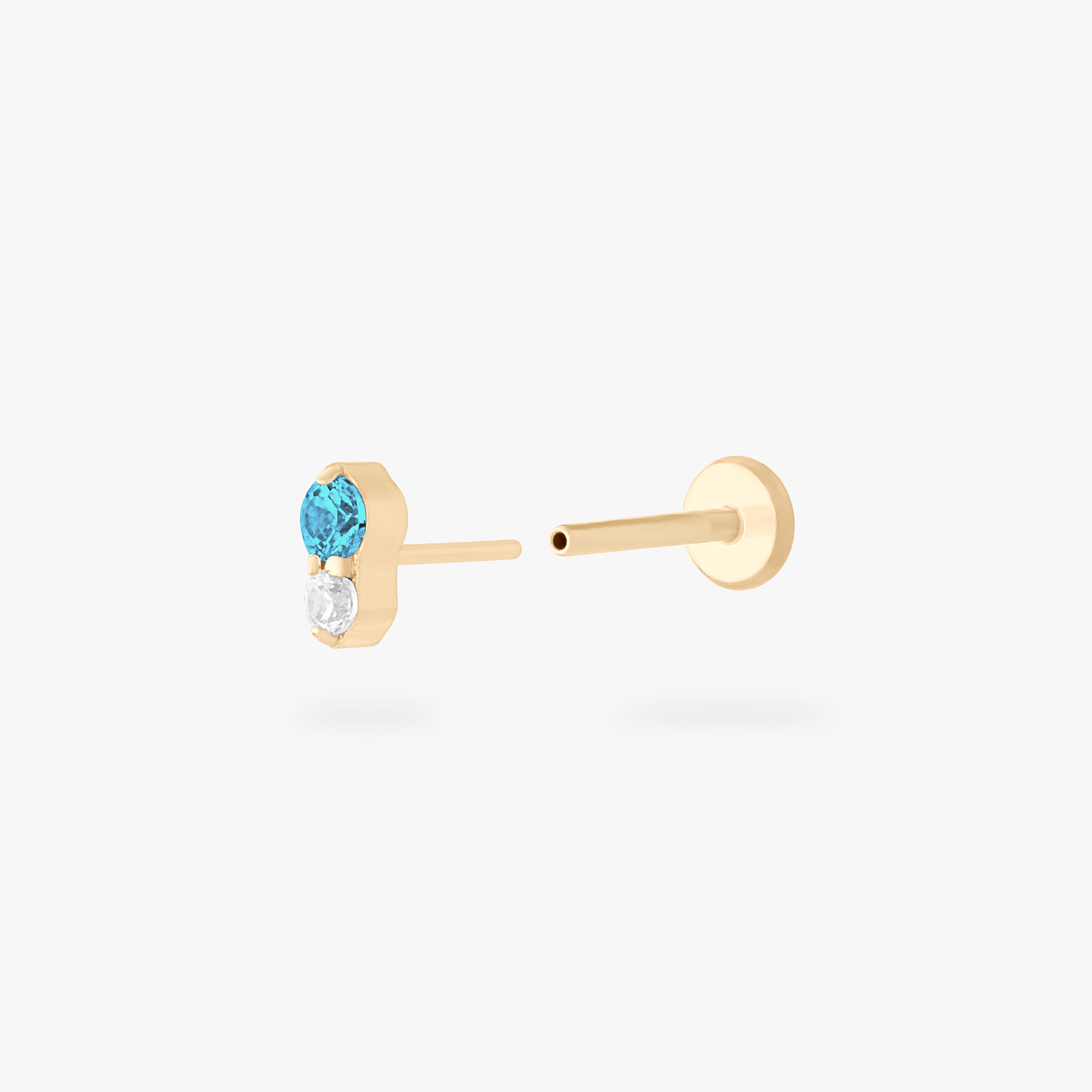 This is a gold flatback stud with an aquamarine cz stacked over a clear cz. color:null|aquamarine