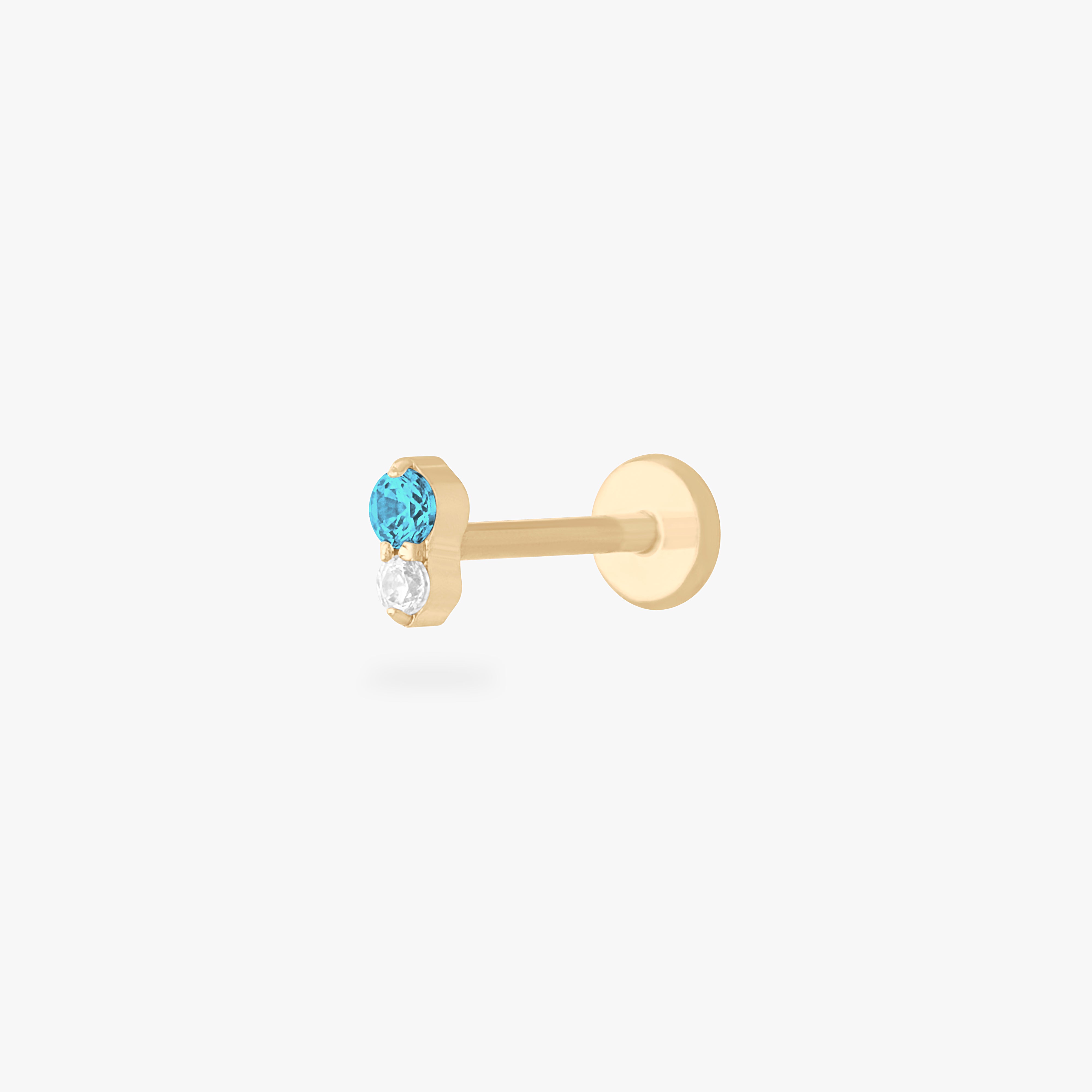This is a gold flatback stud with an aquamarine cz stacked over a clear cz. color:null|aquamarine