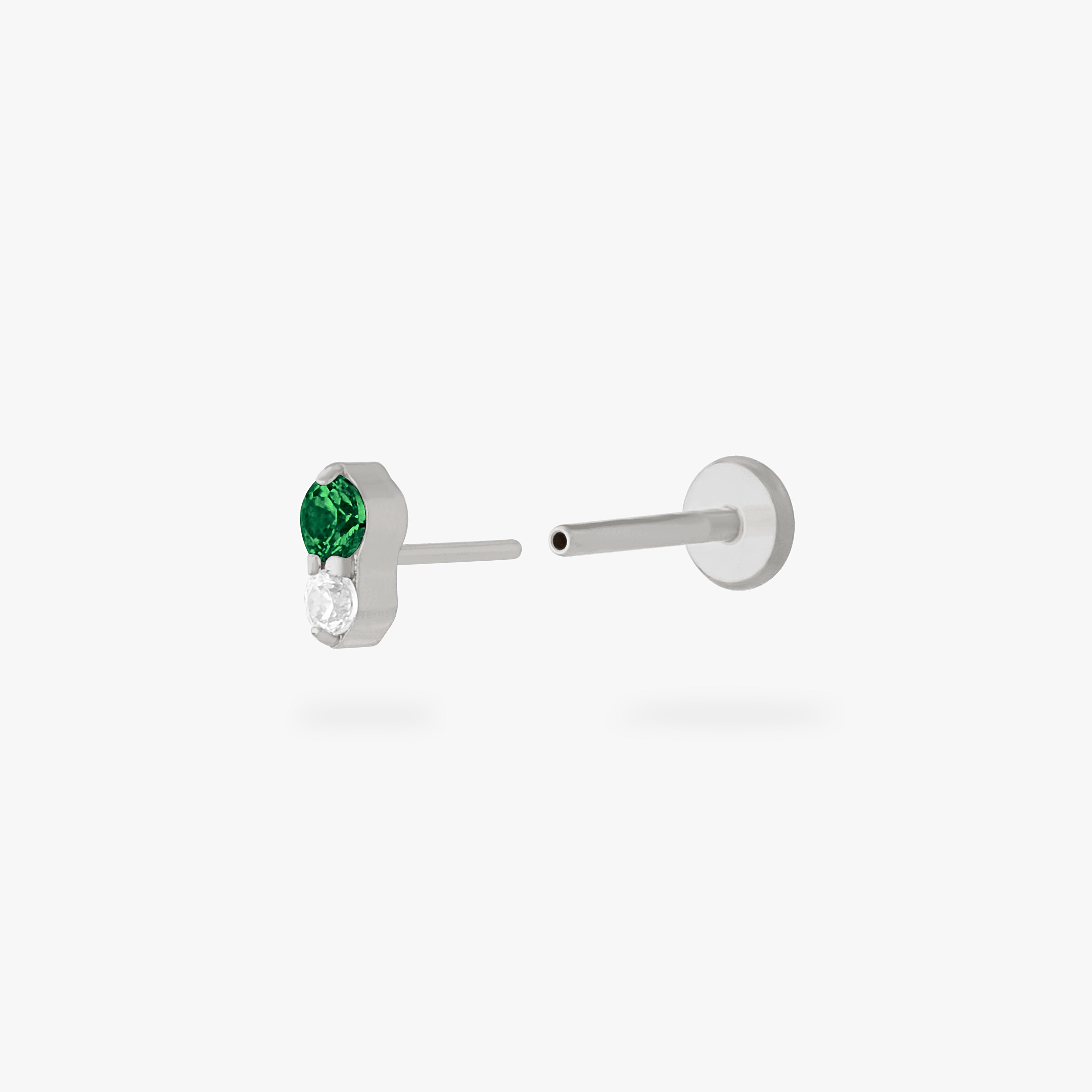 This is an image of a silver flatback stud composed of titanium with a green cz stone stacked over a clear cz stone. color:null|silver/green