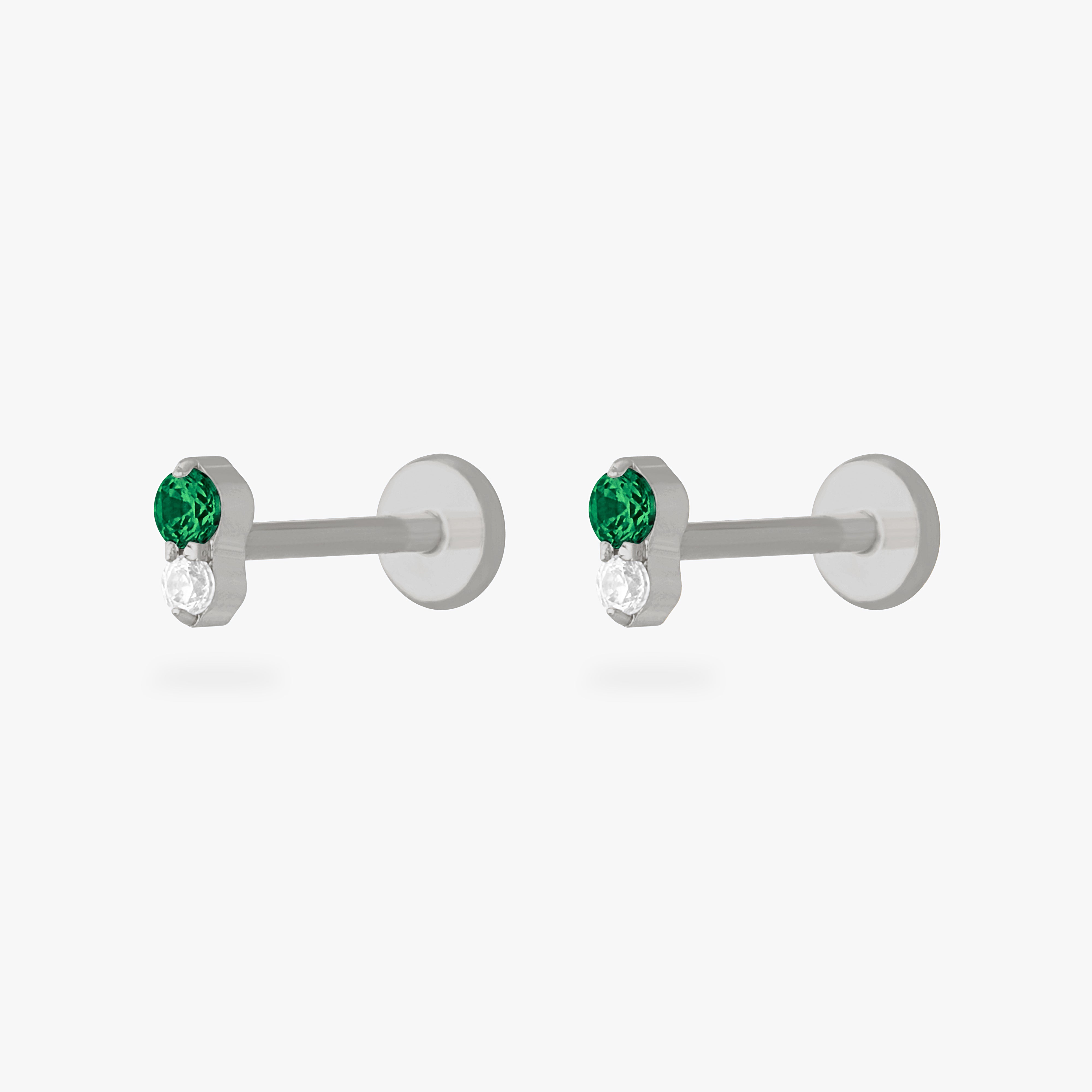 This is an image of a pair of silver flatback studs composed of titanium with green cz stones stacked over clear cz stones. [pair] color:null|silver/green