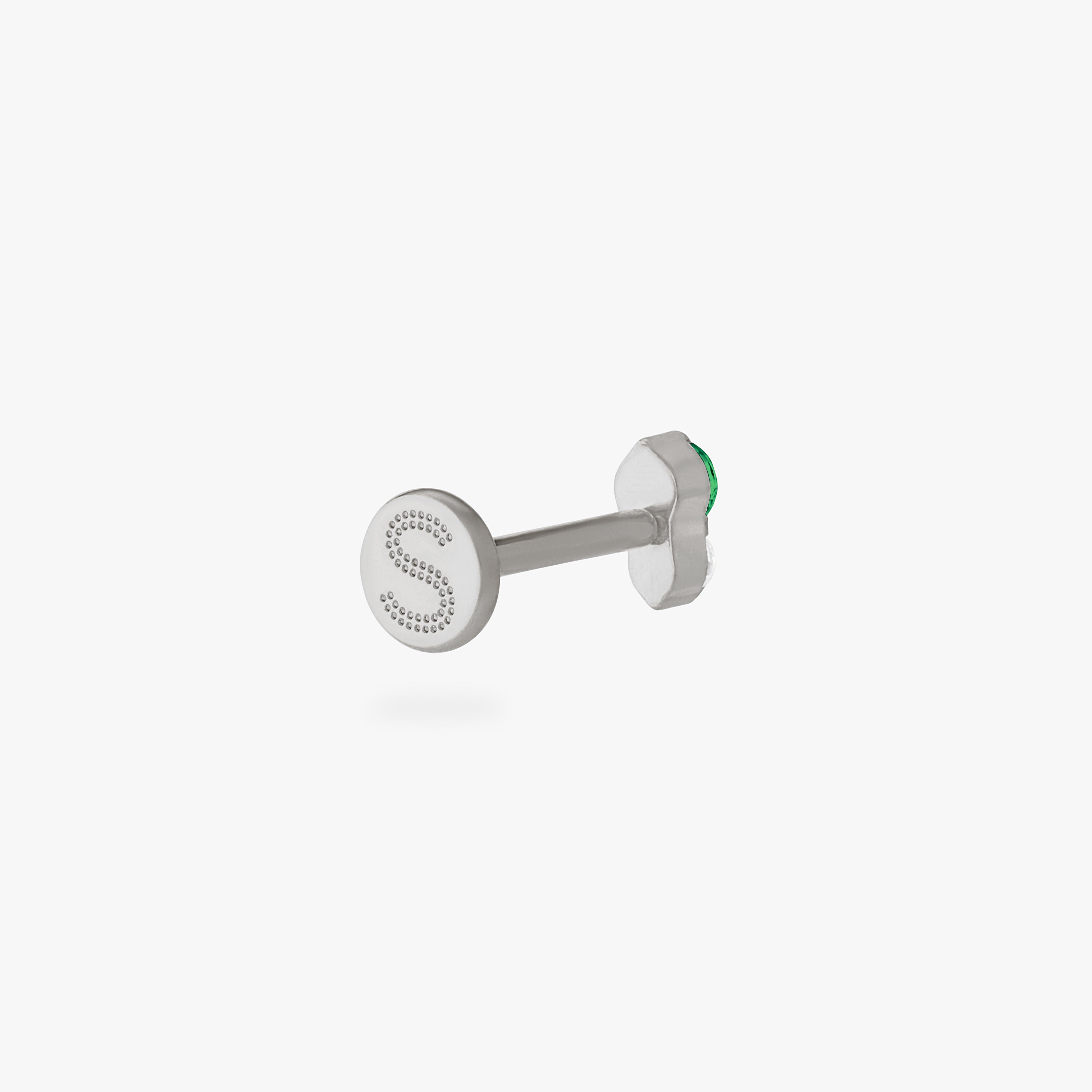 This is an image of a silver flatback stud composed of titanium with a green cz stone stacked over a clear cz stone. color:null|silver/green