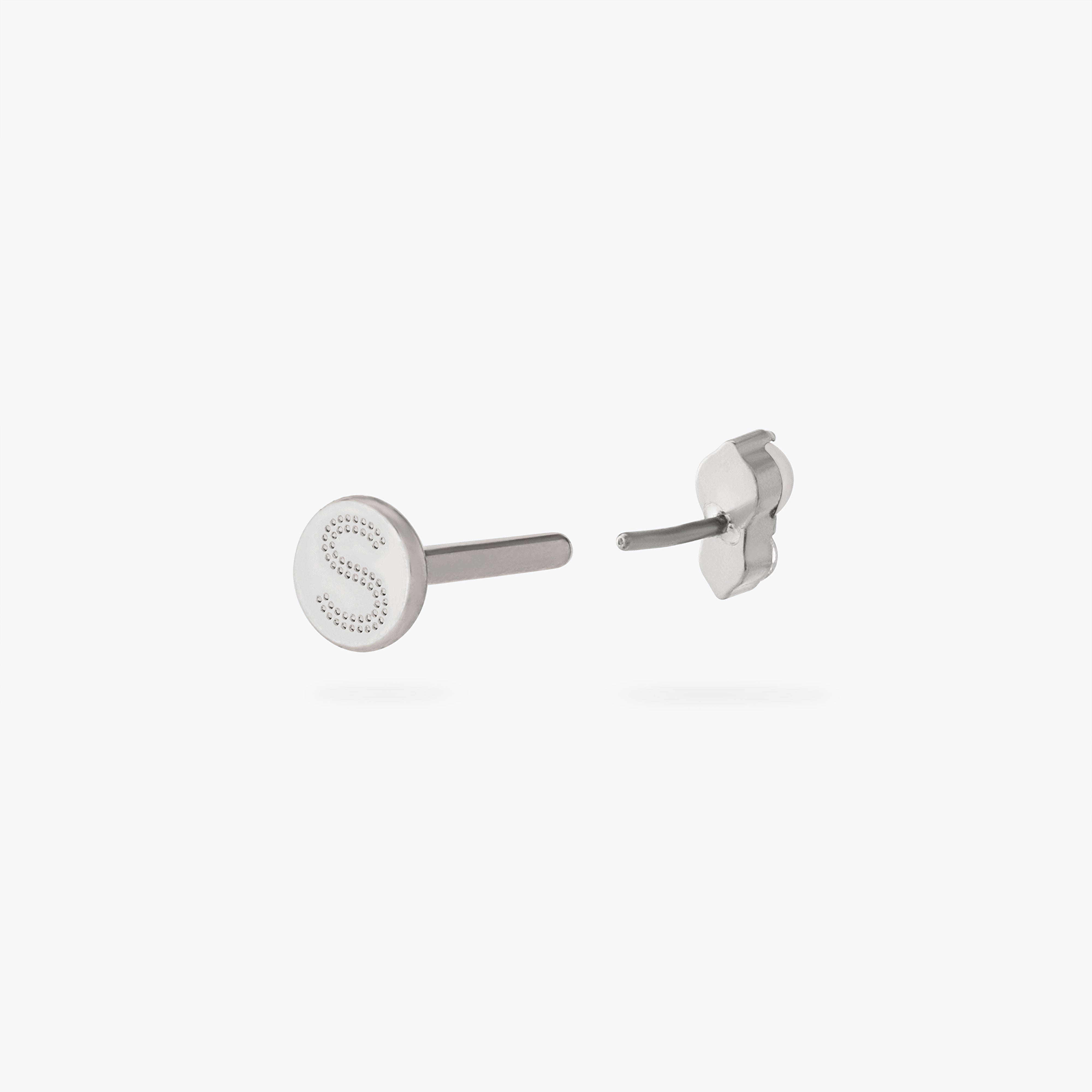 This is an image of a silver flatback stud composed of titanium with a pearl stone stacked over a clear cz stone. color:null|silver/pearl
