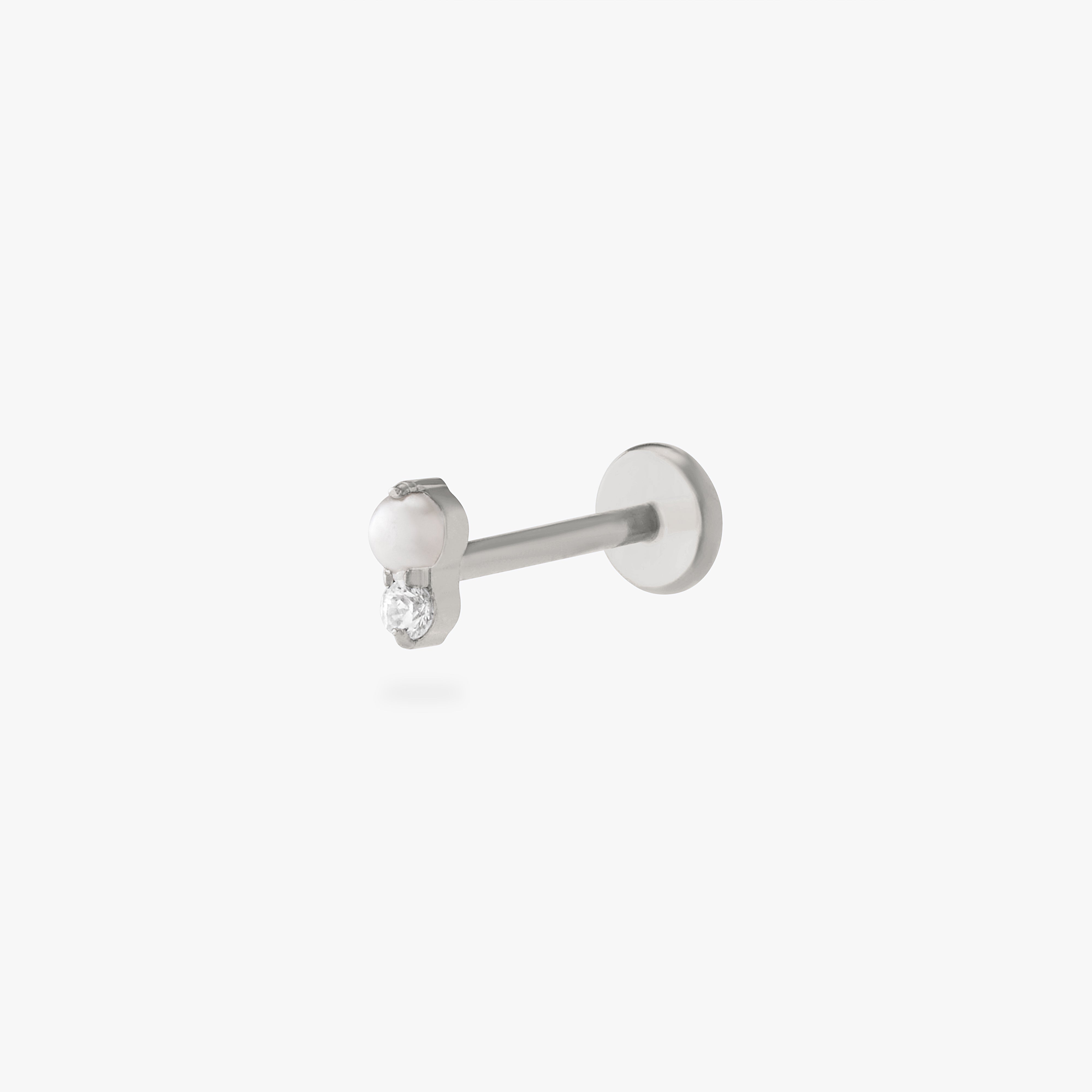 This is an image of a silver flatback stud composed of titanium with a pearl stone stacked over a clear cz stone. color:null|silver/pearl