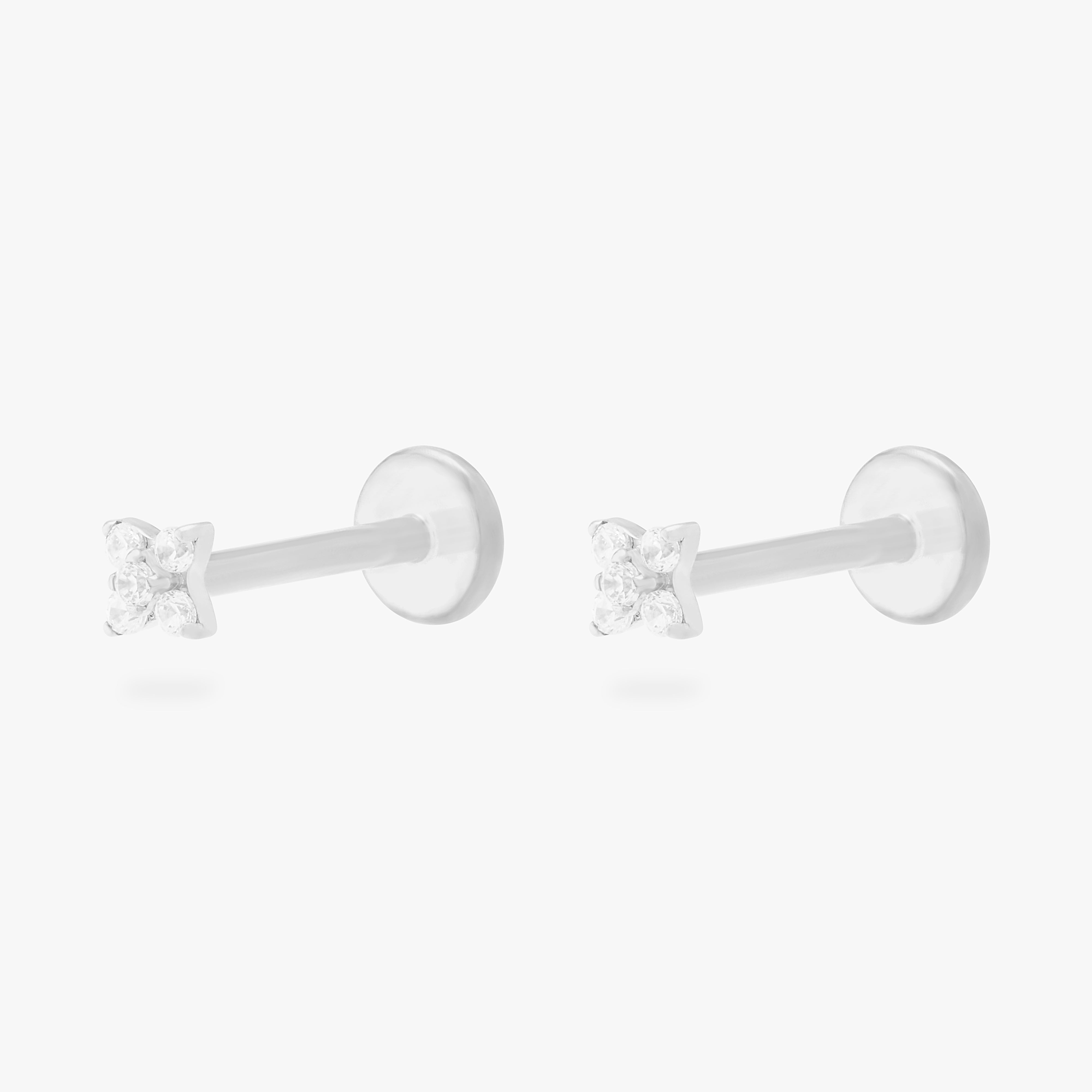 This is an image of a pair of silver-toned flatback studs that have pave cz stones in the shape of an X. [pair] color:null|silver/clear