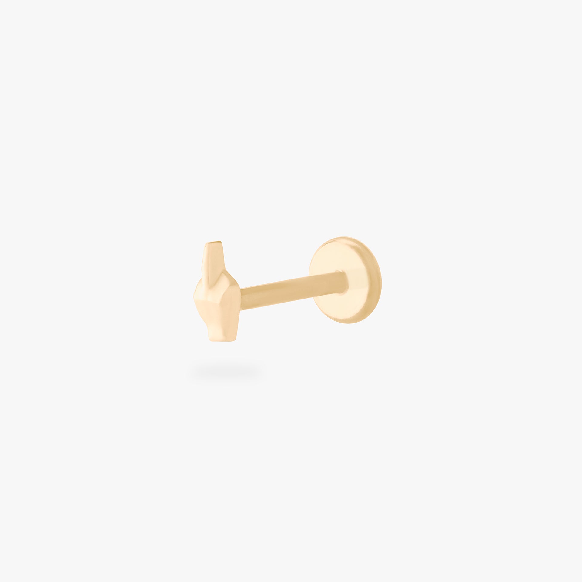 This is an image of a gold-toned flatback stud that is in the shape of a middle finger. color:null|gold