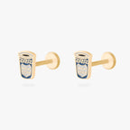This is an image of a pair of gold-toned flatback studs in the shape of coffee cups with blue and white enameling. [pair] color:null|gold/blue