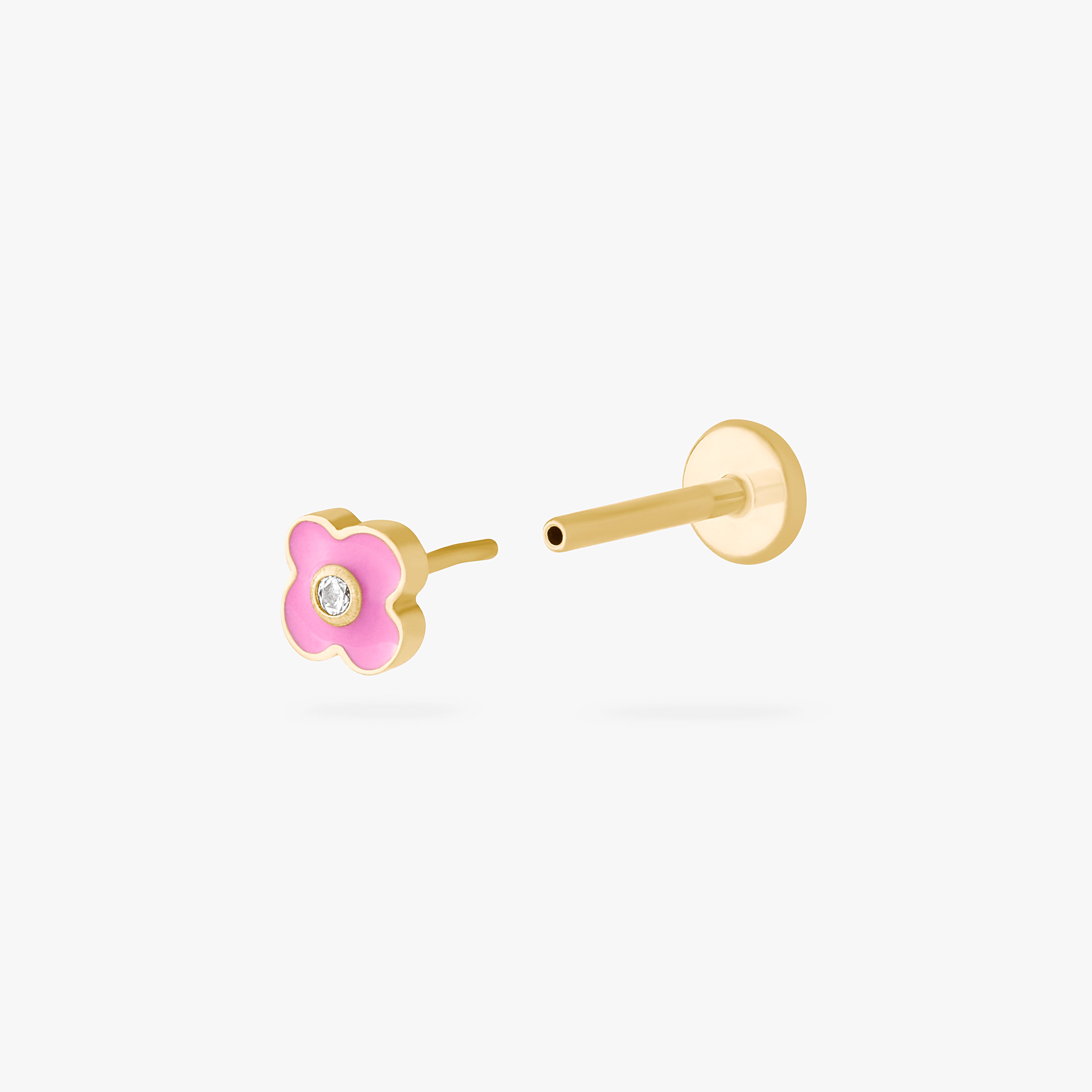 This is an image of a gold toned flatback with a flower shape of pink enamel. color:null|gold/pink