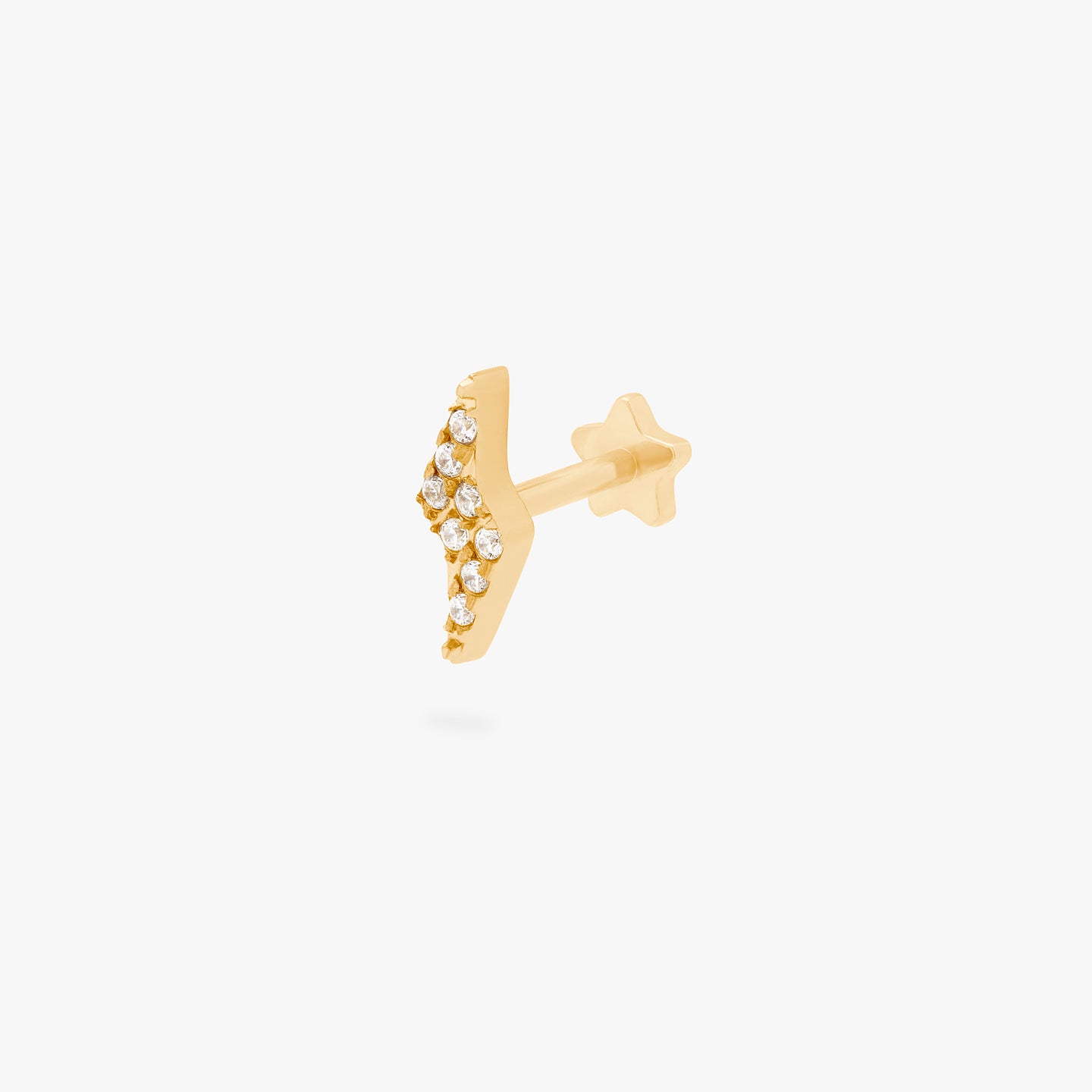 This is an image of a gold/clear pave lightning-bolt shaped flatback top with a gold labret that has a star-shaped disc. color:null|gold/clear