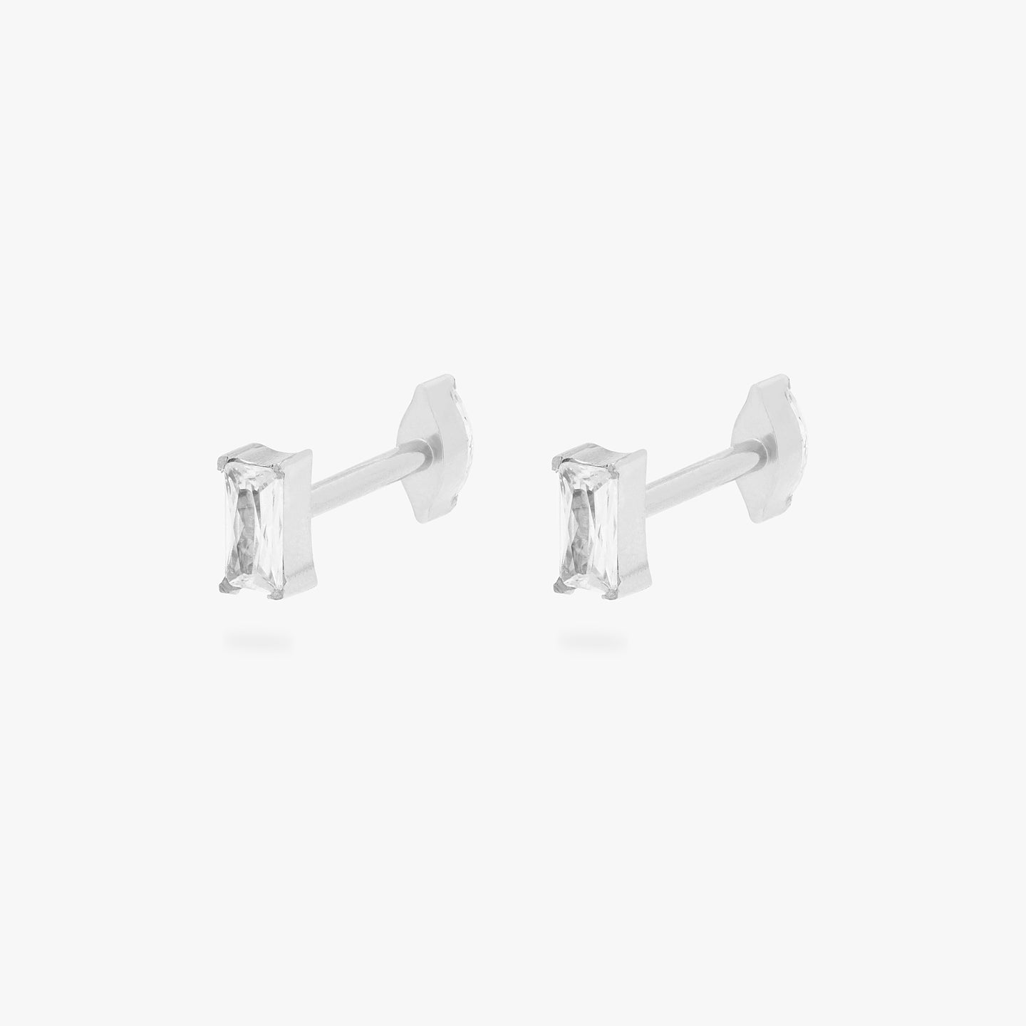 This is an image of a pair of silver/clear baguette shaped CZ flatback tops with silver/clear marquise shaped CZ flatback posts. [pair] color:null|silver/clear