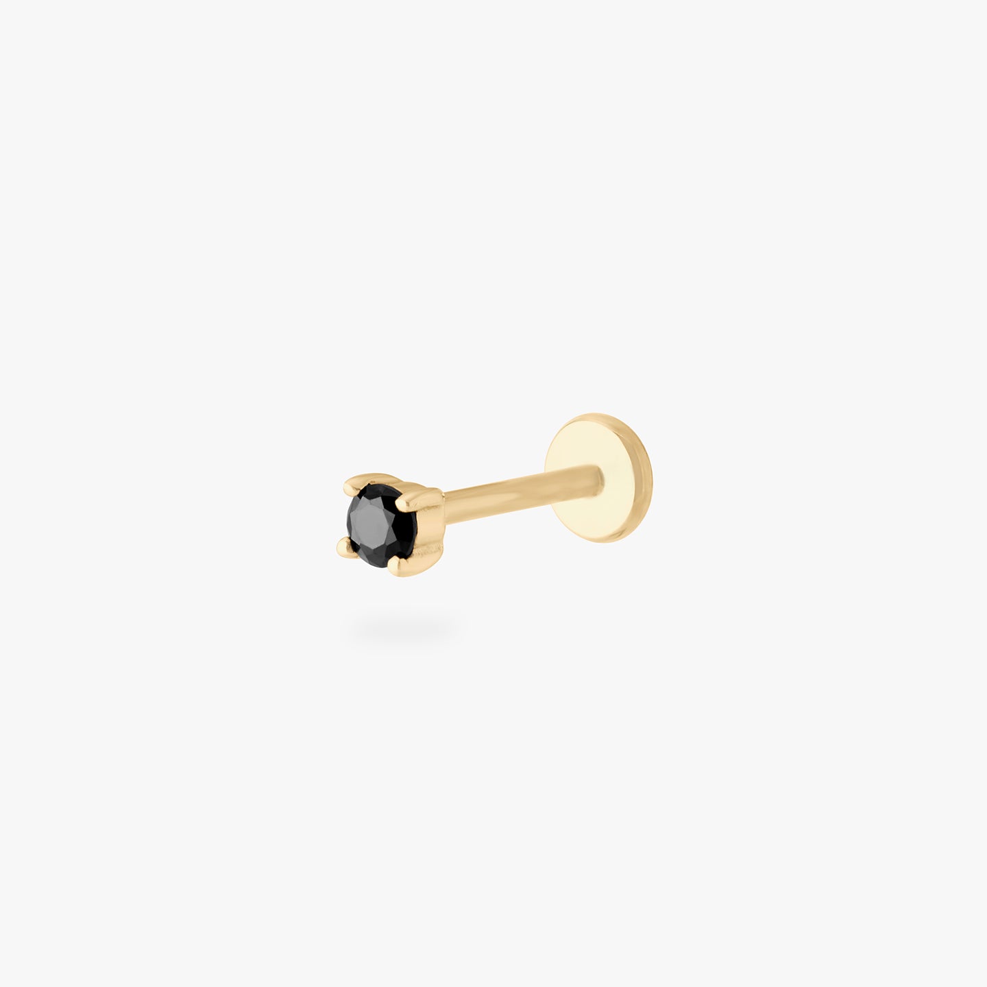 a black mini cz stud set in a 14k gold setting color:null|gold/black