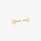 This is an image of a 14K gold flatback stud with a pointed star with a clear cz stone in the center. color:null|gold|gold/clear