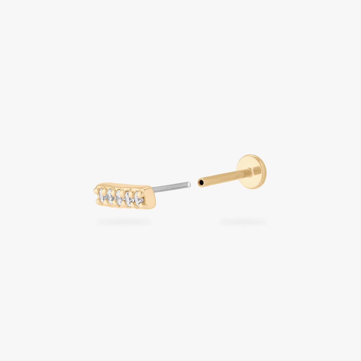 This image shows the front of the 14k pave bar Flatback separated from the labret 