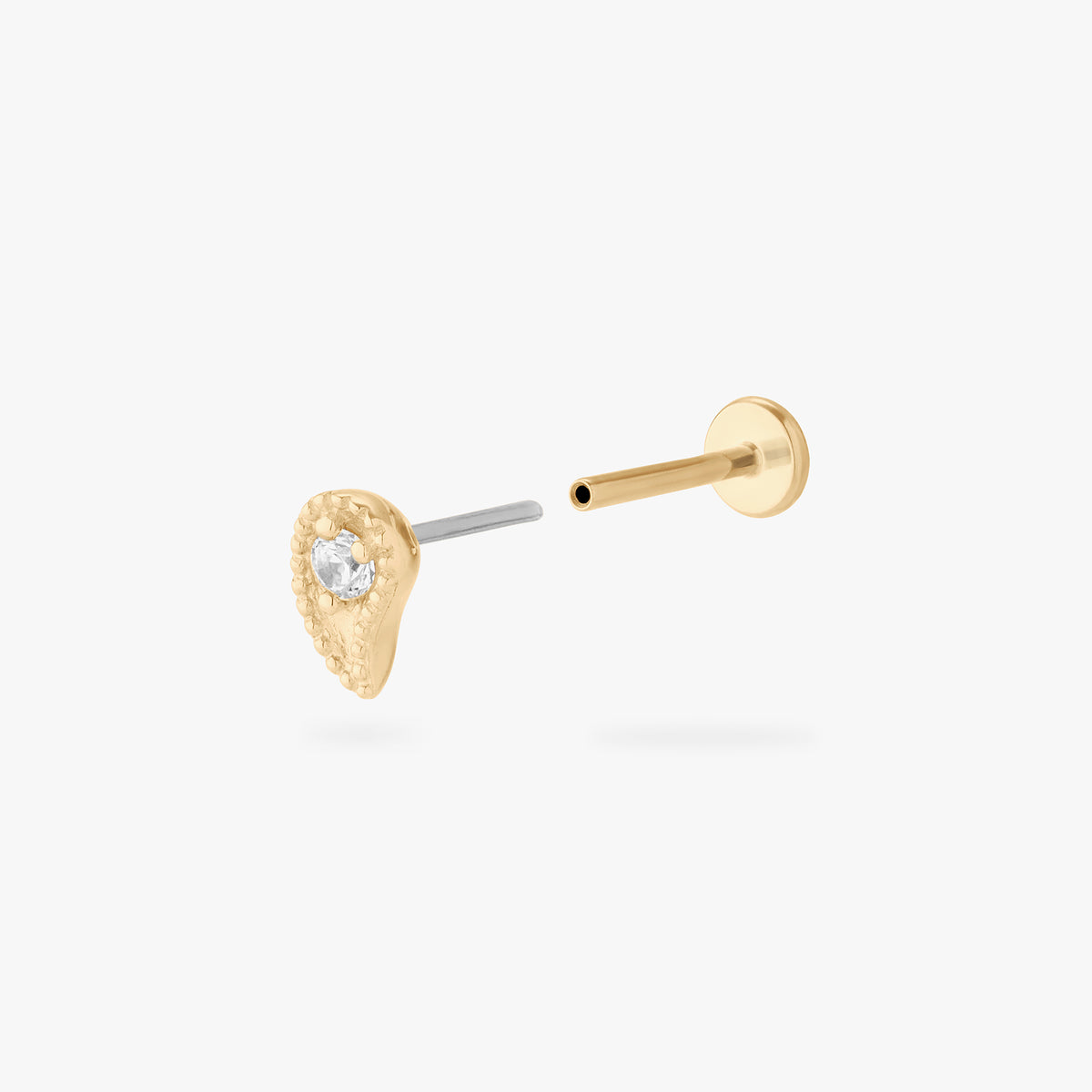 This image shows the front view of the 14k gold Paisley flatback stud separated from the labret 