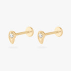 This image shows a pair of 14k Paisley flatback studs with a cz clear stone in the middle.