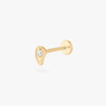 This is an image of a 14K flatback stud in the shape of a paisley with a crystal CZ.