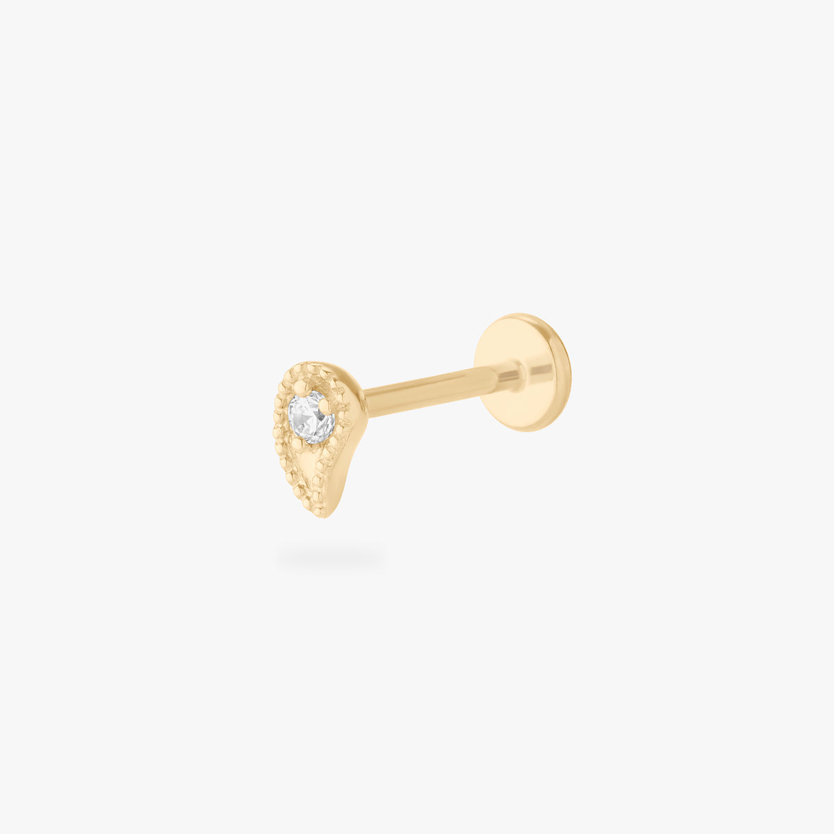 This is an image of a 14K flatback stud in the shape of a paisley with a crystal CZ.