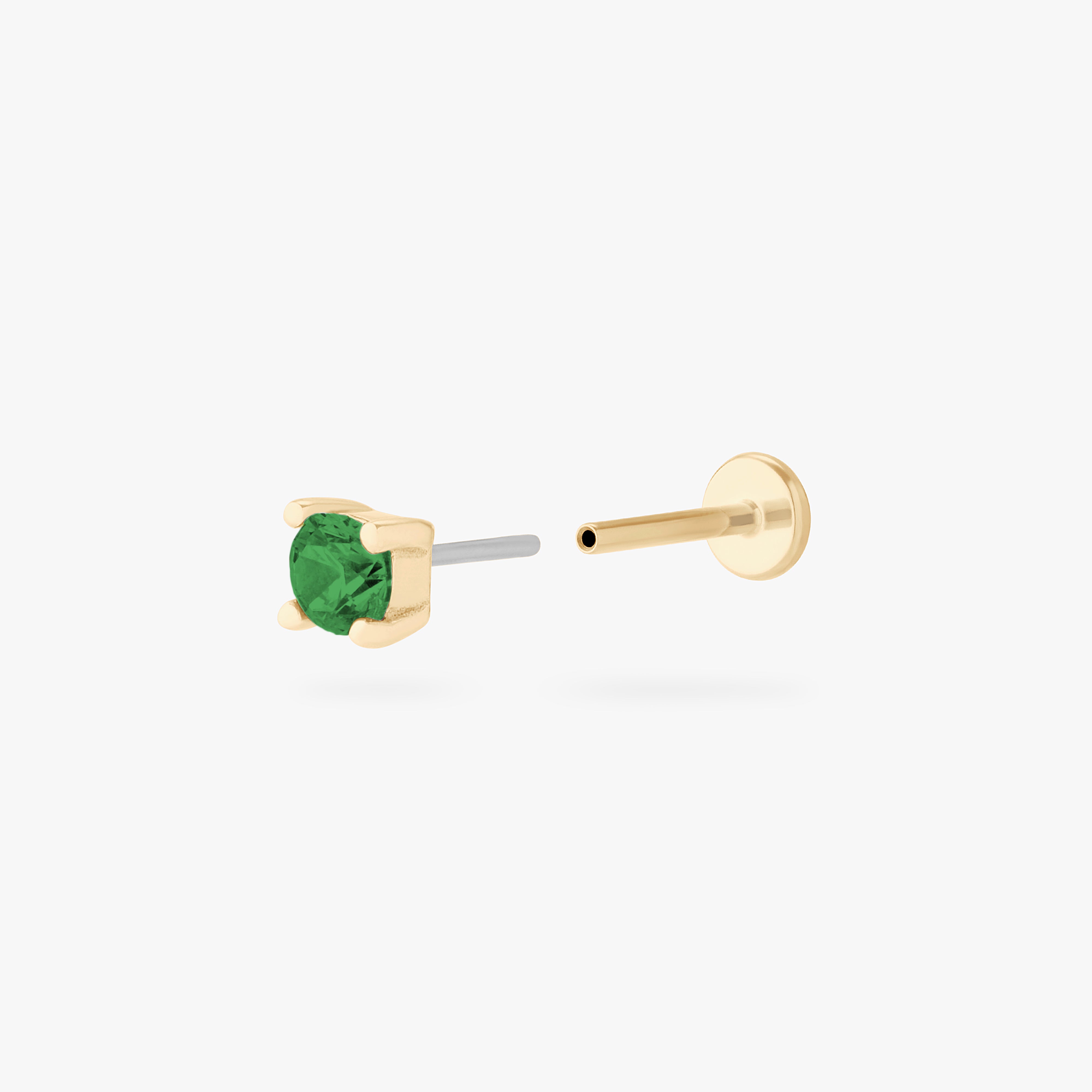 This is an image of a 14k gold flatback with a 2.5mm cz setting and green cz stone. color:null|14k gold|14k gold/green