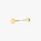 This is an image of a 14k gold flatback with a 2.5mm cz setting and green cz stone. color:null|14k gold|14k gold/green
