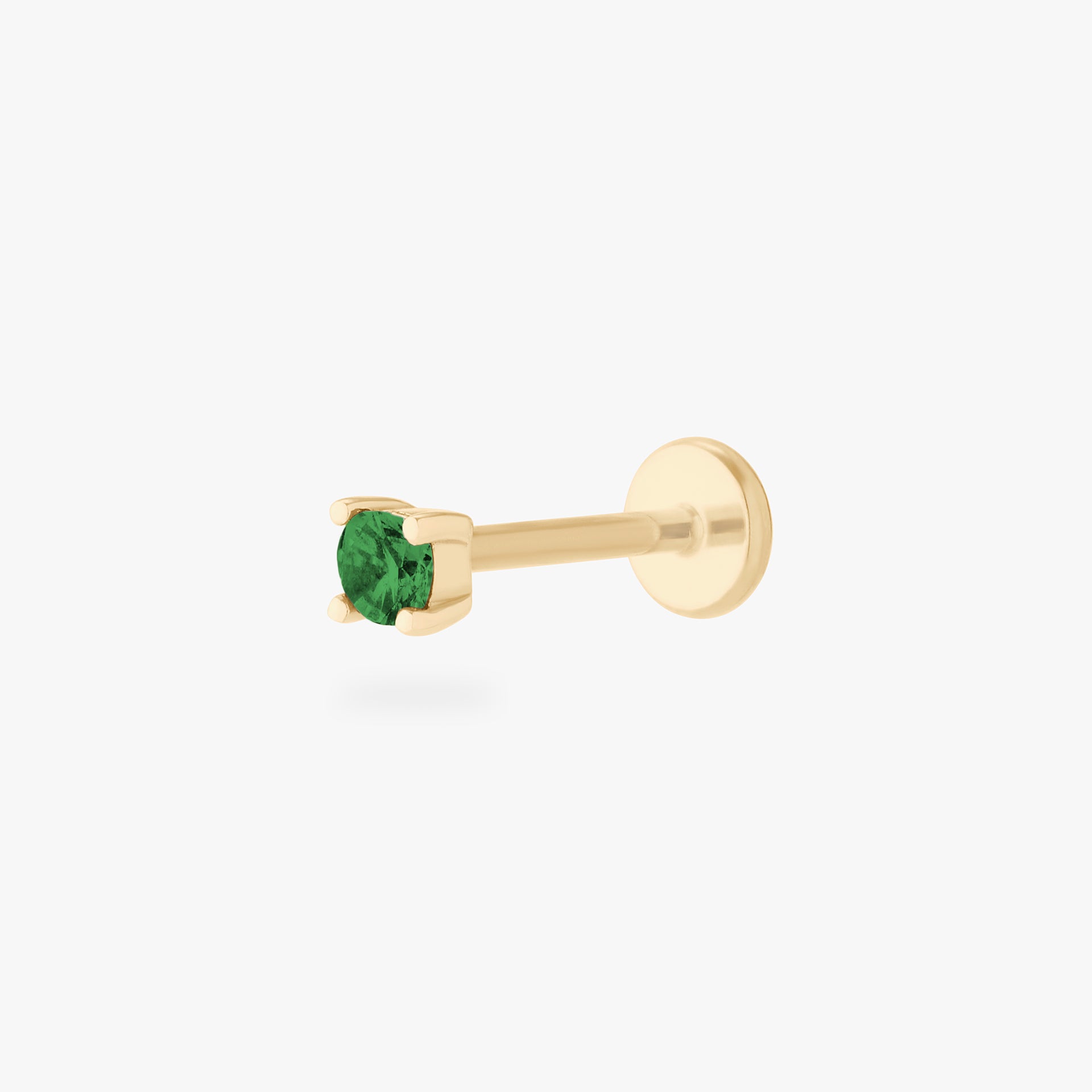 This is an image of a 14k gold flatback with a 2.5mm cz setting and green cz stone. - Main view