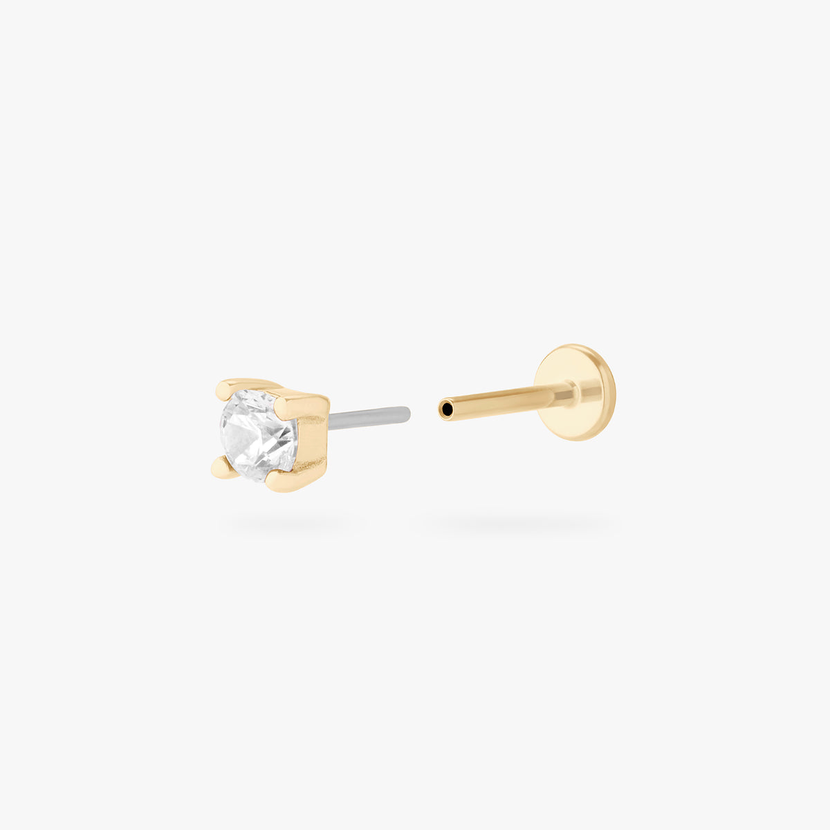 a clear mini cz stud set in a 14k gold setting color:null|gold/clear