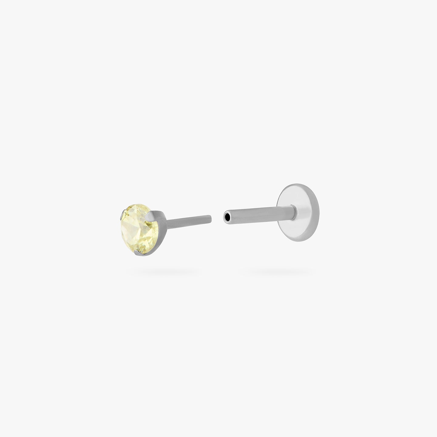 titanium flatback stud with a 2.5mm yellow cz stone that comes with 2 backs in 6mm and 8mm lengths color:null|silver/yellow