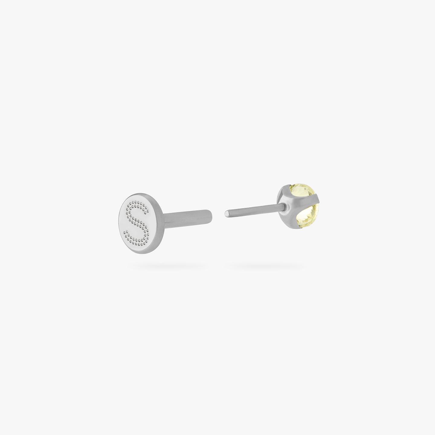 titanium flatback stud with a 2.5mm yellow cz stone that comes with 2 backs in 6mm and 8mm lengths color:null|silver/yellow