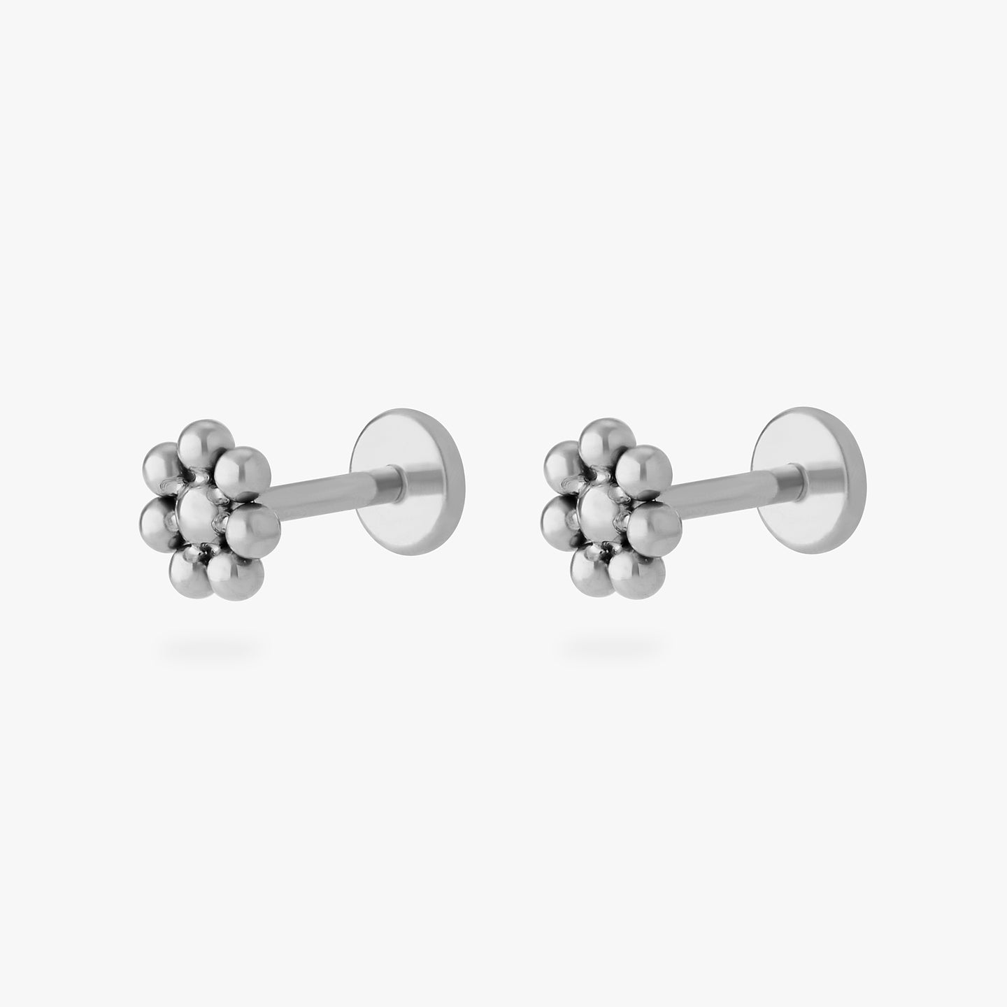 a small flower-shaped titanium flatback stud [pair] color:null|titanium