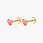 This image shows the side view of a pair of the 14k yellow gold enamel heart flatback stud. 