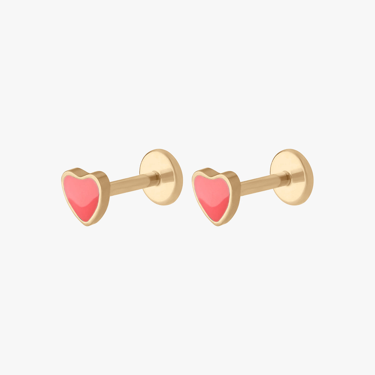 This image shows the side view of a pair of the 14k yellow gold enamel heart flatback stud. 
