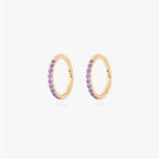 This is a pair of gold toned clickers with amethyst cz stones. [pair] color:null|amethyst