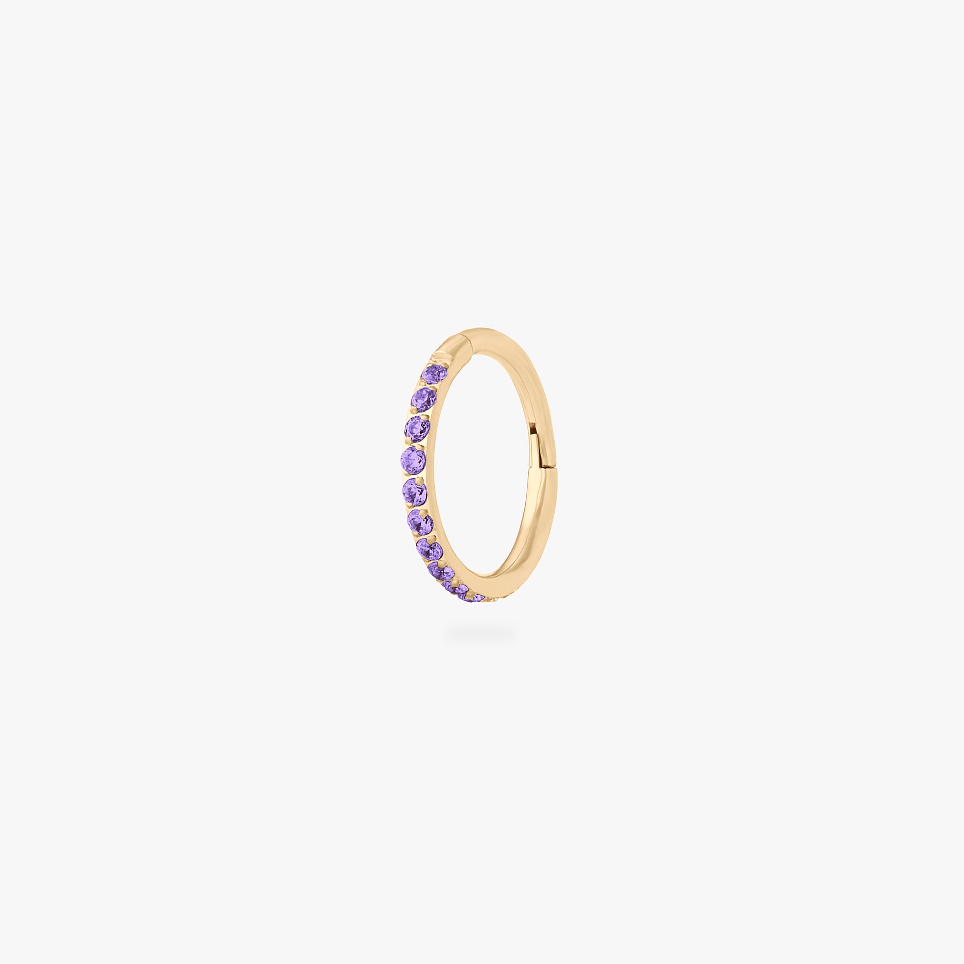 This is a gold toned clicker with amethyst cz stones. - Main view