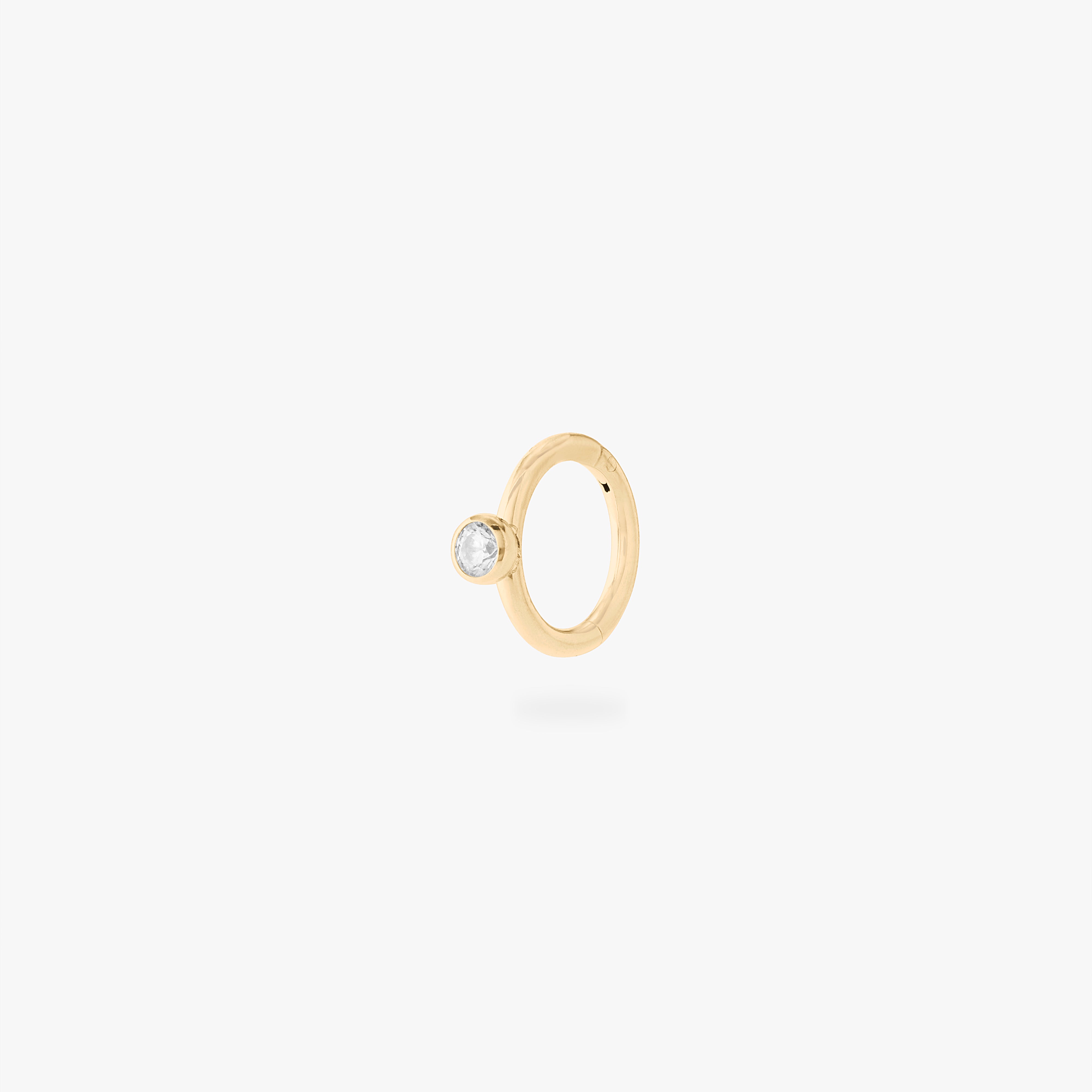 gold 6mm clicker with a clear bezel cz accent color:null|gold/clear