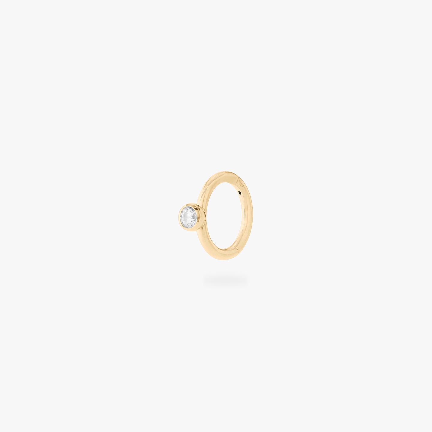 gold 6mm clicker with a clear bezel cz accent color:null|gold/clear