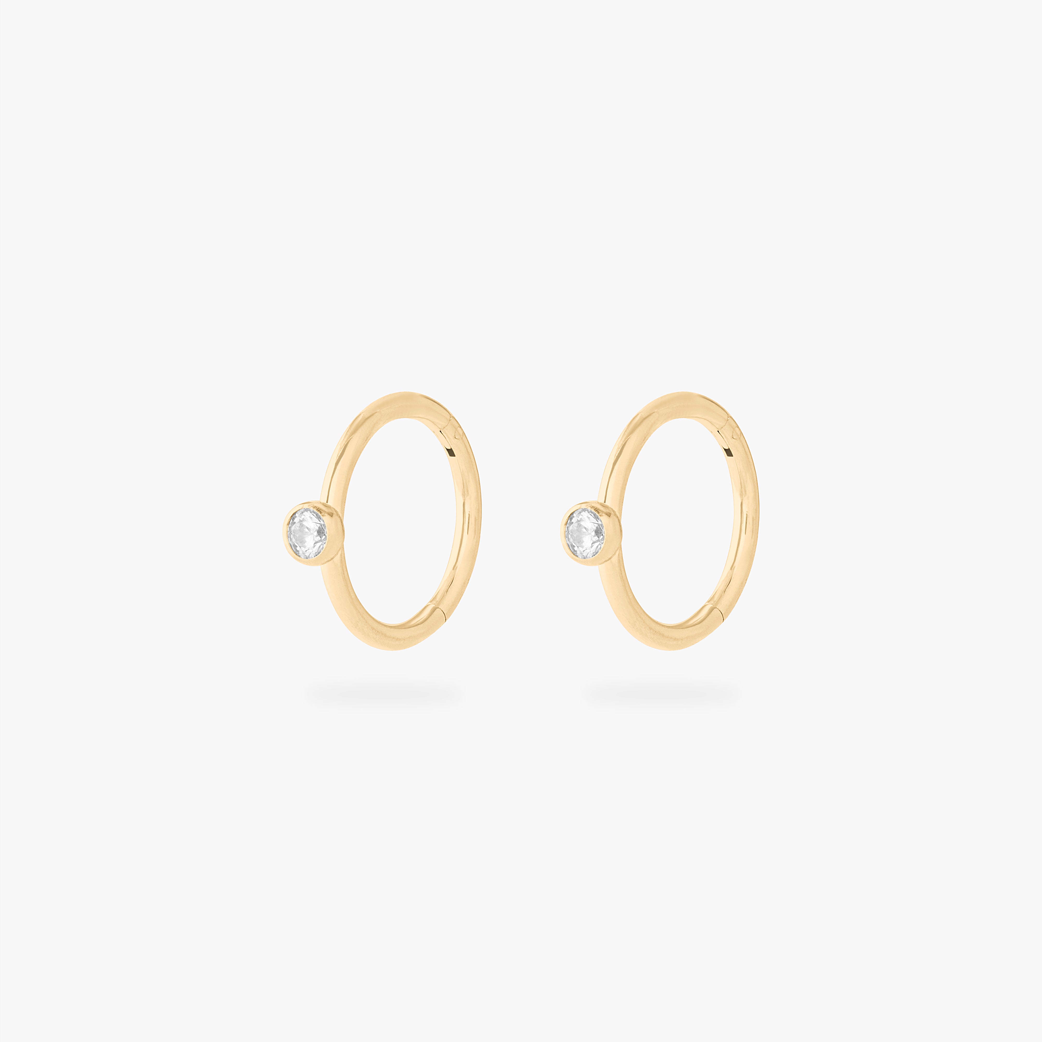 gold clicker with a cz bezel accent stone [pair] color:null|gold/clear