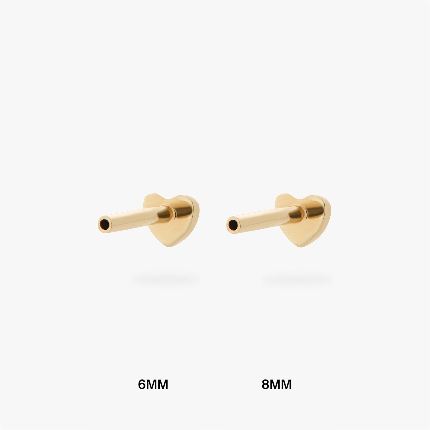 An image of a gold heart shaped flatback post that is 6mm in length next to a gold heart shaped flatback post that is 8mm in length. color:null|6mm length