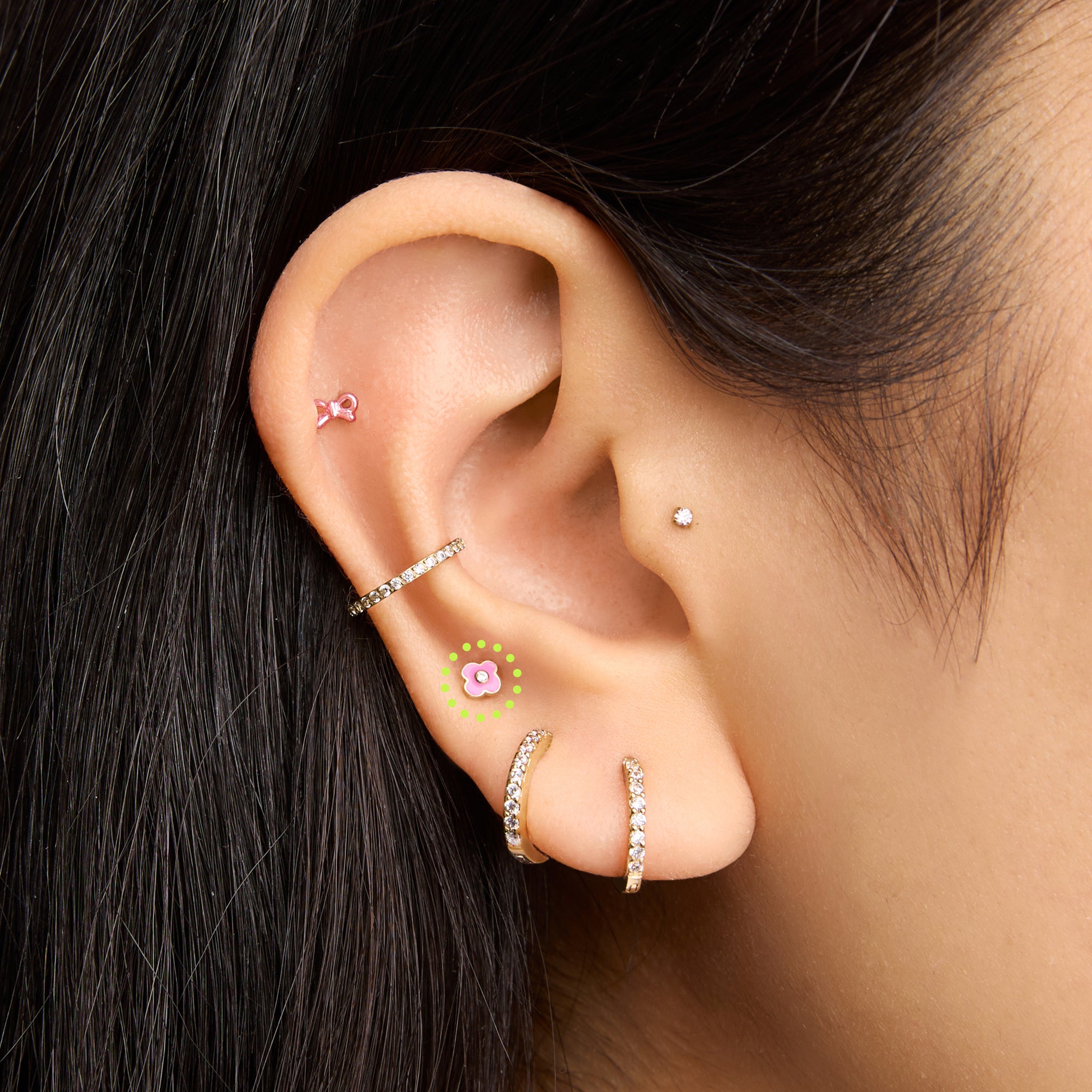 This is an image of a gold toned flatback with a flower shape of pink enamel on ear. [hover] color:null|gold/pink