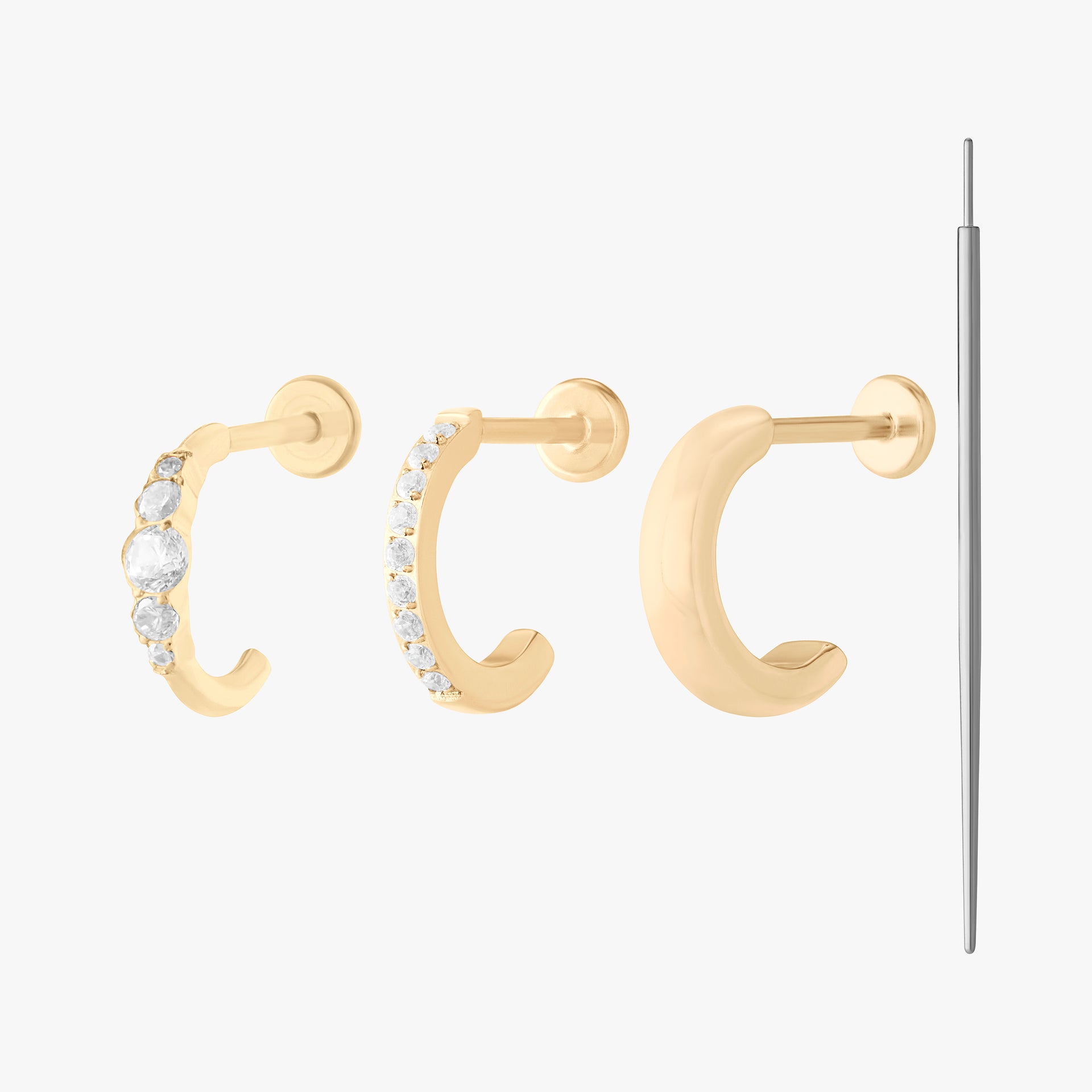 set of all gold flatback huggies with an insertion tool color:null|gold/clear