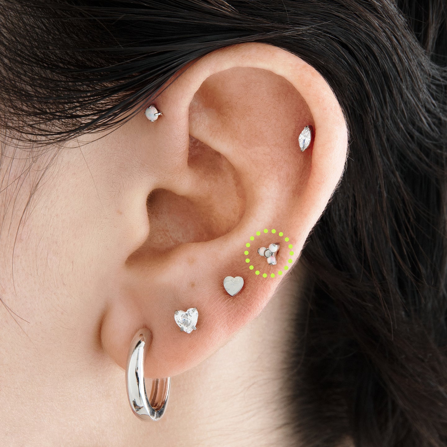 on ear featuring a titanium trio of small opal studs set together in a triangle shape [hover] color:null|titanium/opal