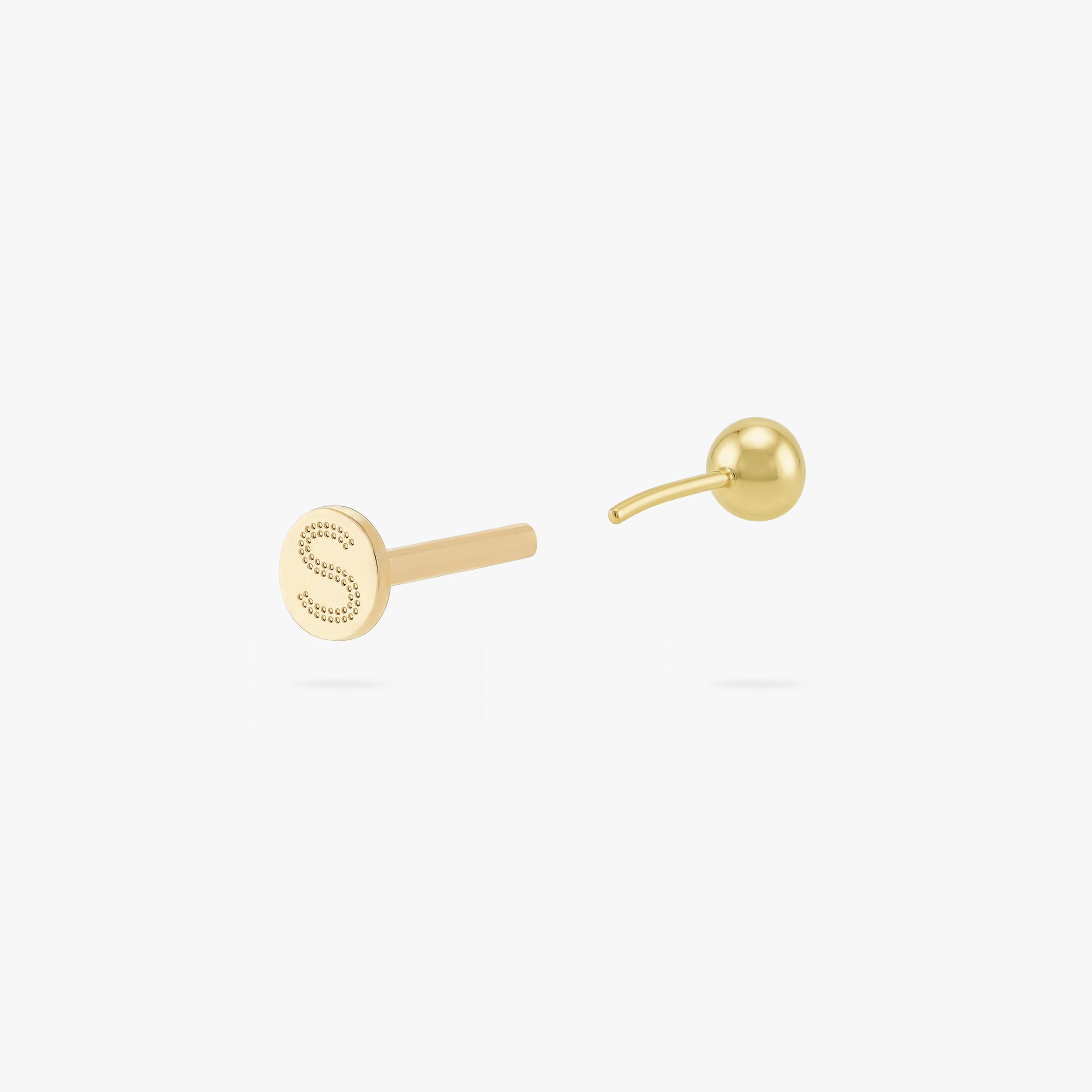 This is an image of a gold toned flatback stud with a 3mm, bezel set green CZ stone. - Alternative view 4