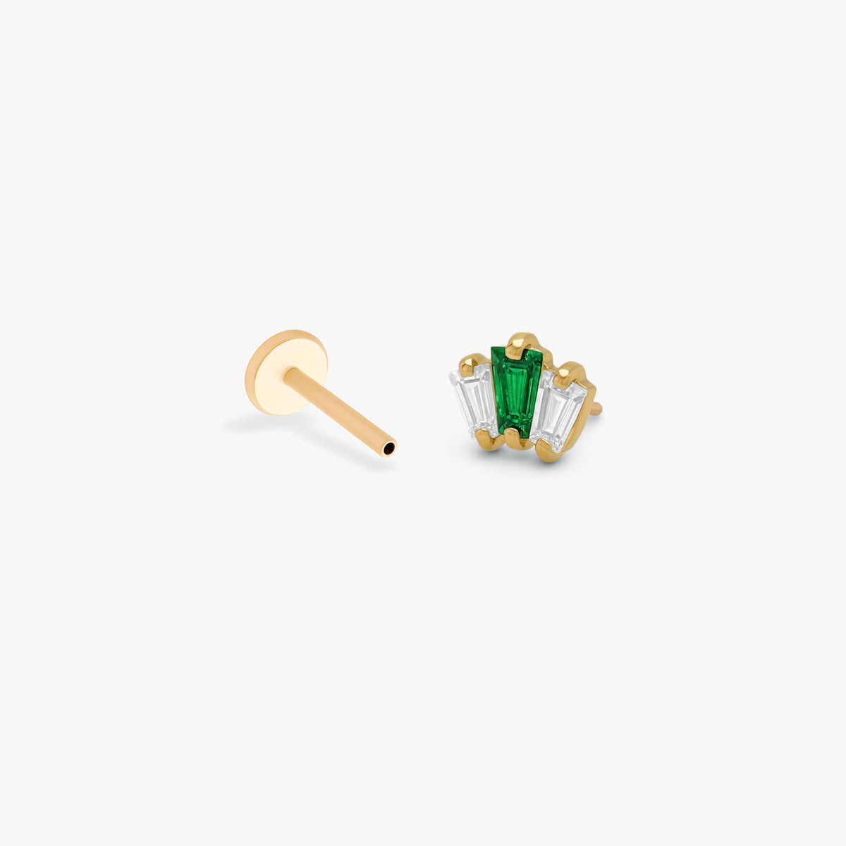 This image the side view of the golden ti micro crown baguette flatback separated from labret. the flatback has two clear cz and one green cz in the middle. 