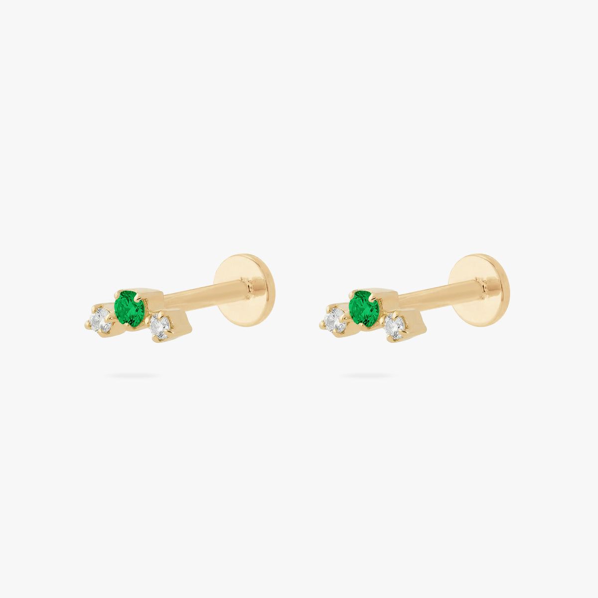 this image shows a pair of gold plated micro cluster flatbacks with two clear and one green cz stones