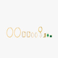 This image shows a set of 14k Yellow Gold plated earrings. The set includes one thin hoop pair, two pairs of huggies. One square shaped with clear cz stones and another with pearl cz stones. There is a singular open pearl huggie and three singular studs. There is a cowboy boot, a marquise with a green cz stone and a green cz stone stud flatback.