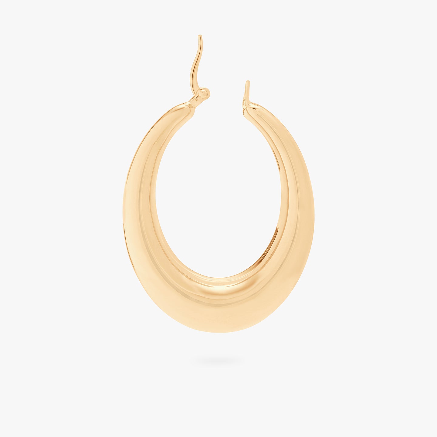 This is a gold, large, oval crescent shaped hoop unhinged. color:null|gold