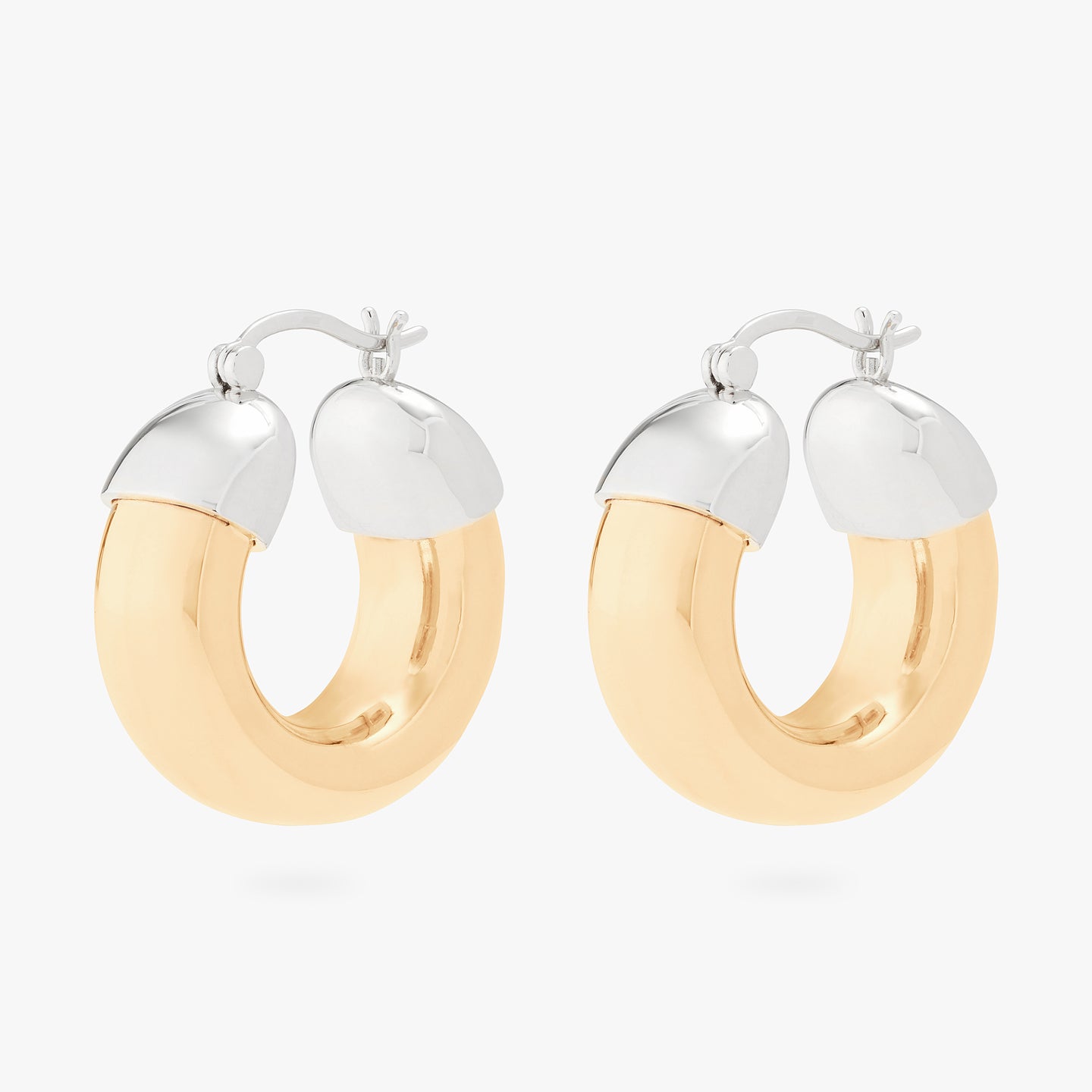 This is an image of a pair of gold based, silver capped, chunky drip hoops. [pair] color:null|gold/silver