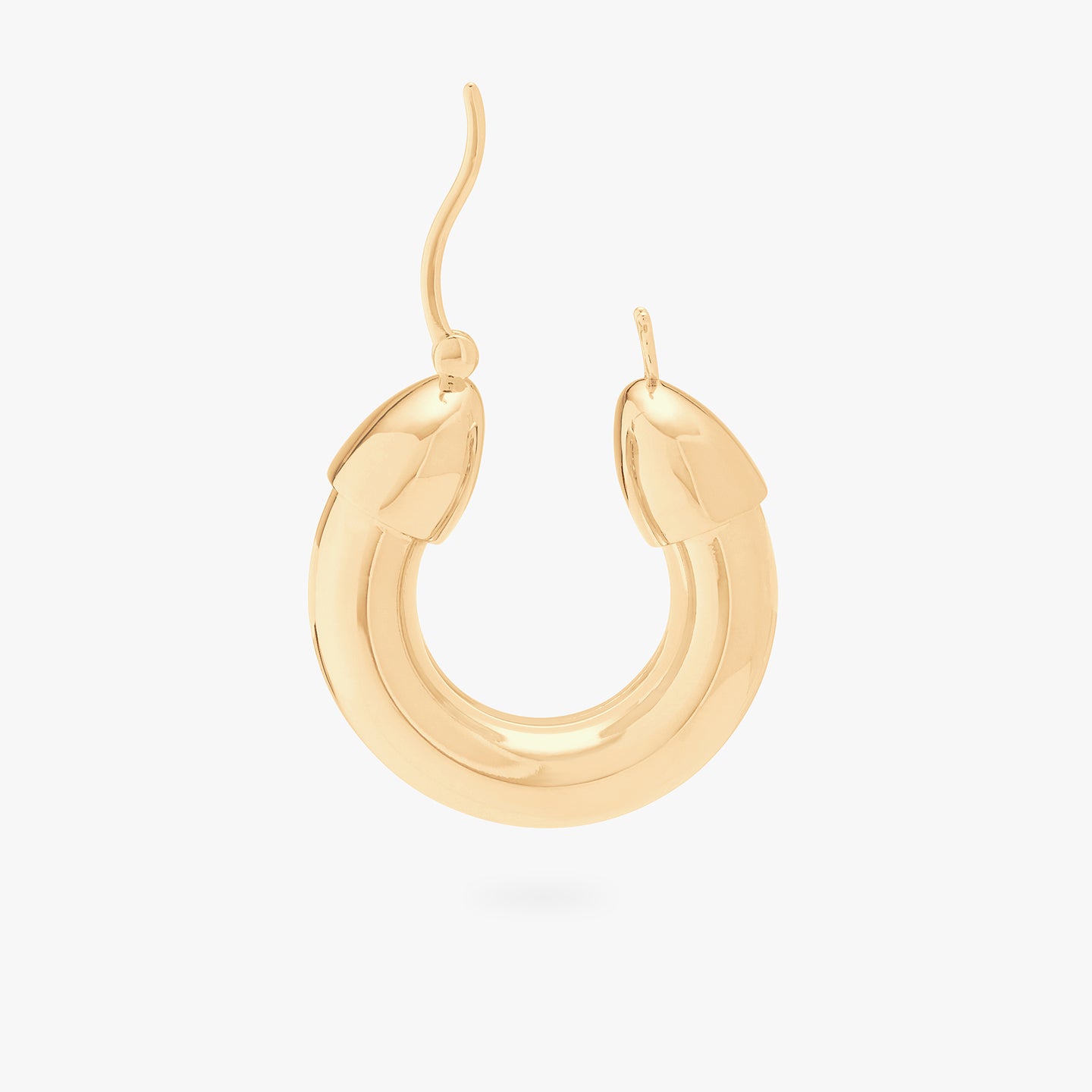 This is an image of a gold, chunky tubed hoop unhinged. color:null|gold