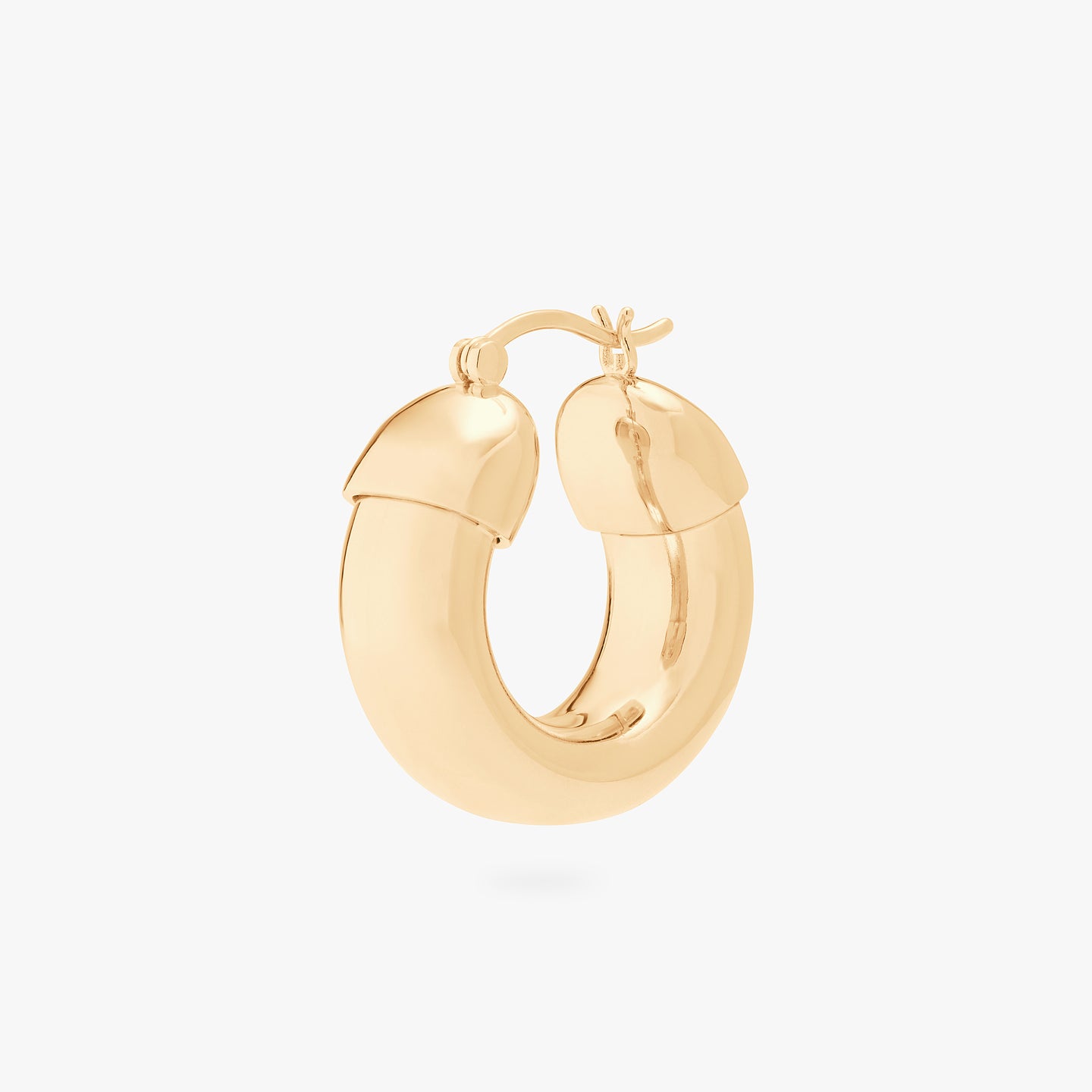 This is an image of a gold, chunky tubed hoop. color:null|gold