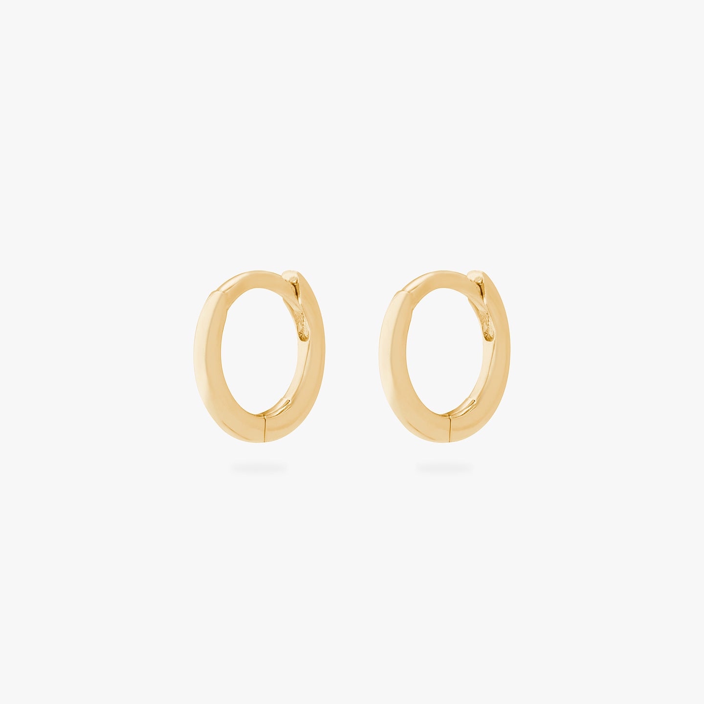 An image of a pair of micro-sized gold huggies (6mm inner diameter). [pair] color:null|gold