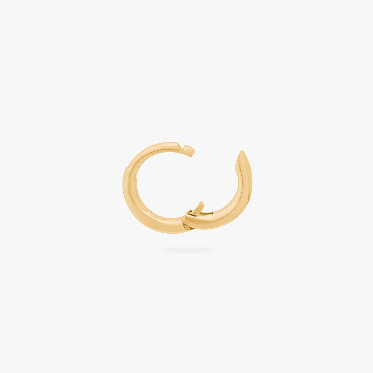 An image of a micro-sized gold huggie (6mm inner diameter) unhinged. color:null|gold
